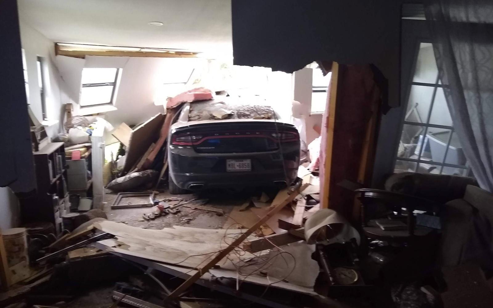 A black 2016 Dodge Charger crashed through a San Angelo home on July 11, 2021. 