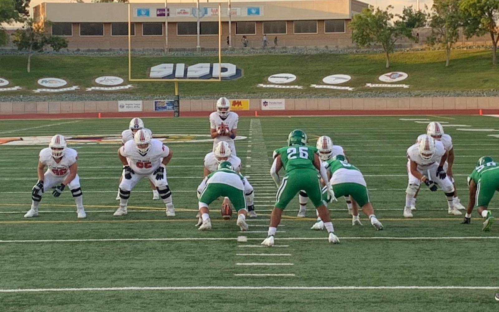 Central QB1 Tyler Hill leads the march to score against El Paso Montwood.