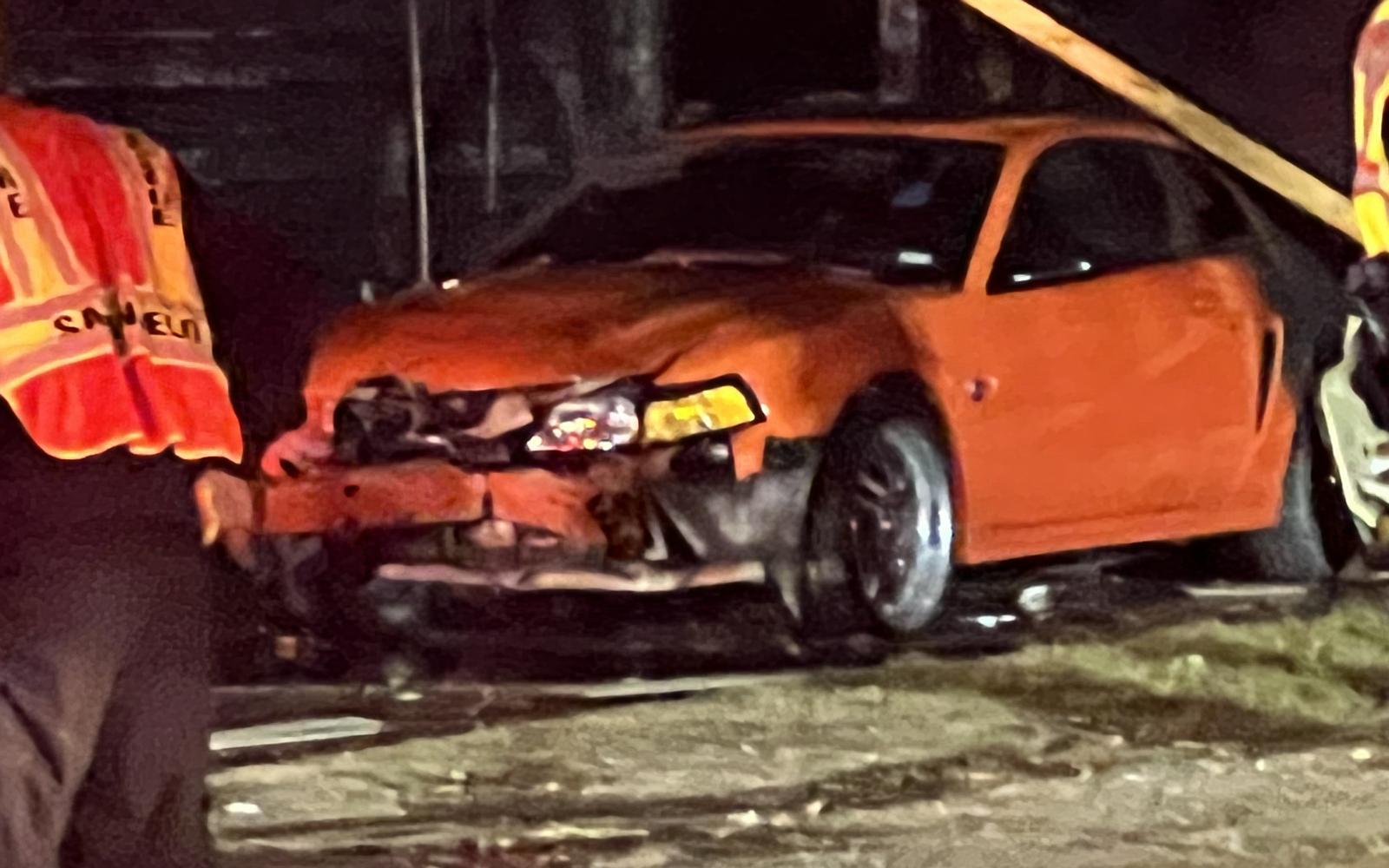 A red car was damaged by flames. San Angelo firefighters battled a fully-engulfed house fire on the evening of Sunday, Nov. 28, 2021