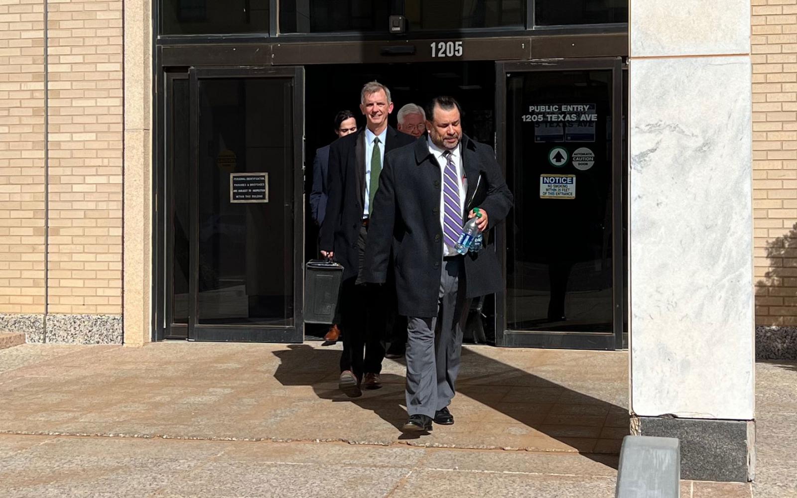 Tim Vasquez leads his attorney David Guinn out of the federal courthouse in Lubbock