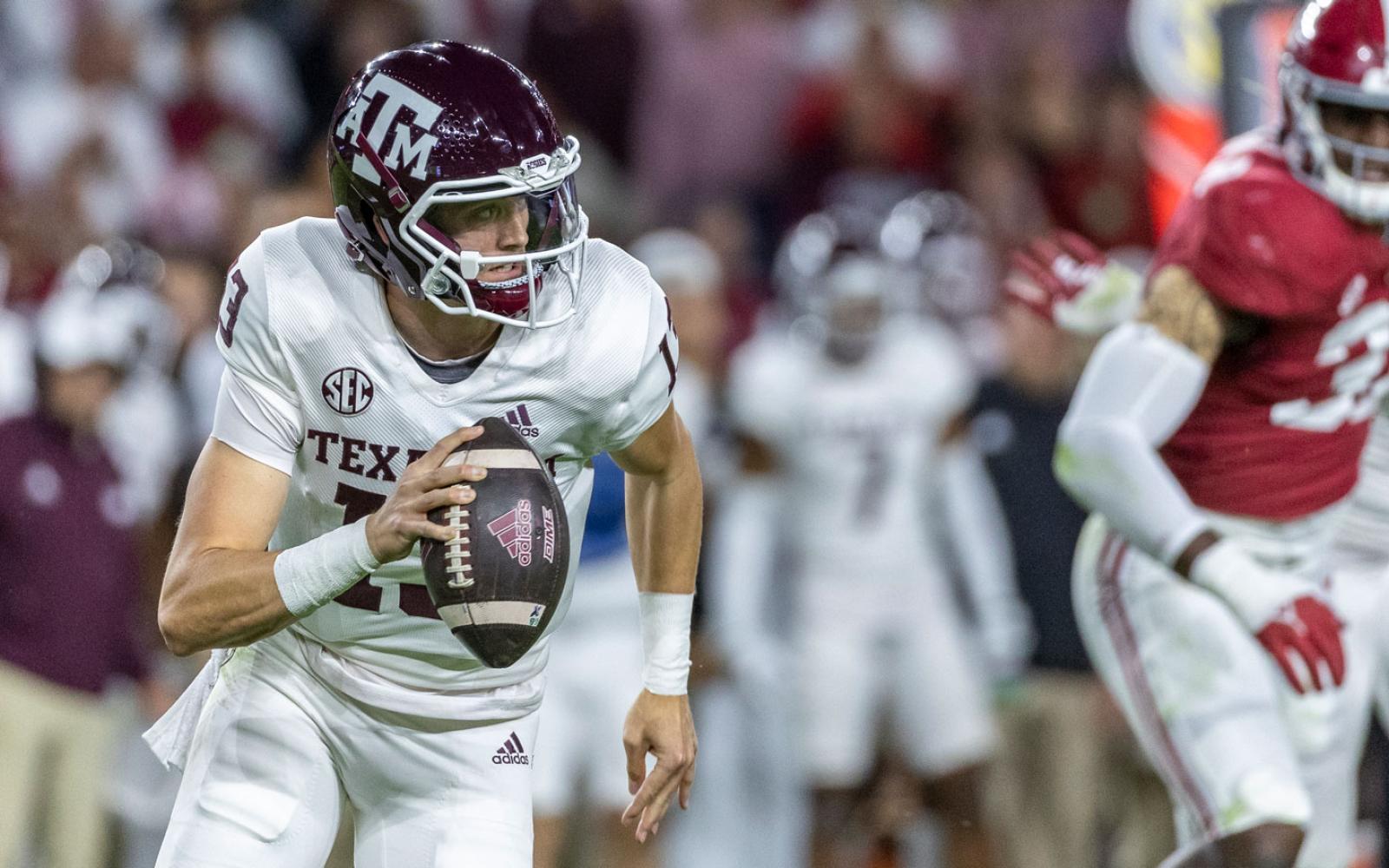 Texas A&M quarterback Haynes King (13) scrambles during the first half of an NCAA college football game against Alabama, Saturday, Oct. 8, 2022, in Tuscaloosa, Ala. (AP Photo/Vasha Hunt)