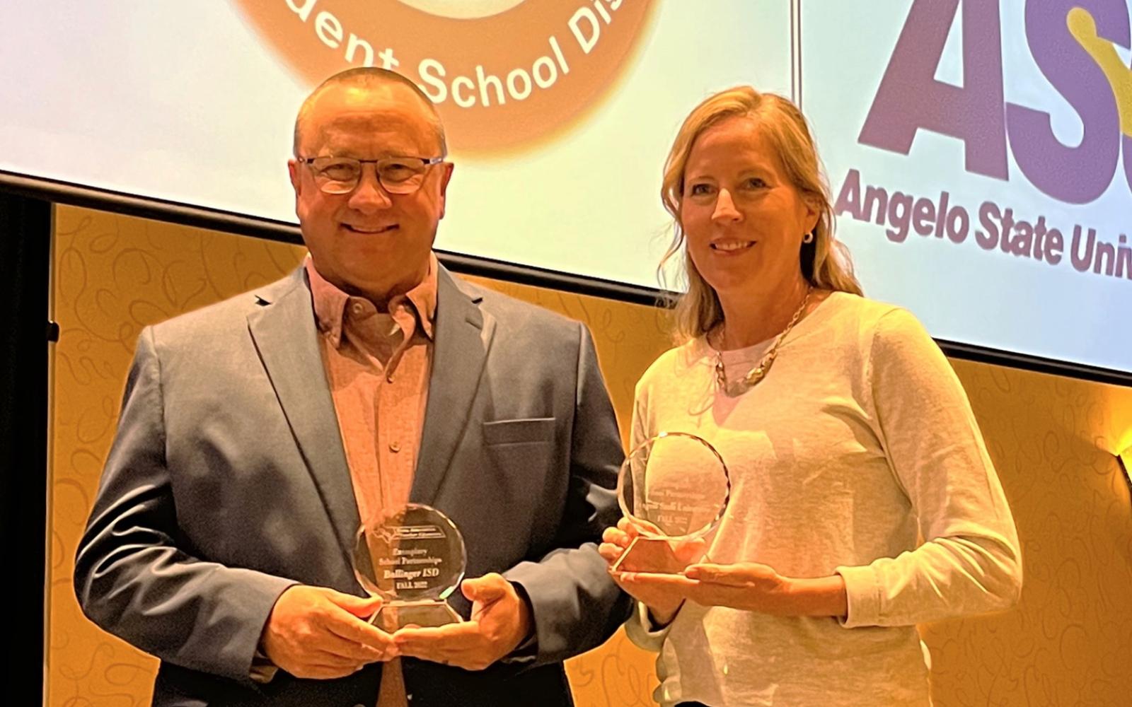 Ballinger ISD Superintendent Jeff Butts and ASU's Dr. Scarlet Clouse with their TxATE awards