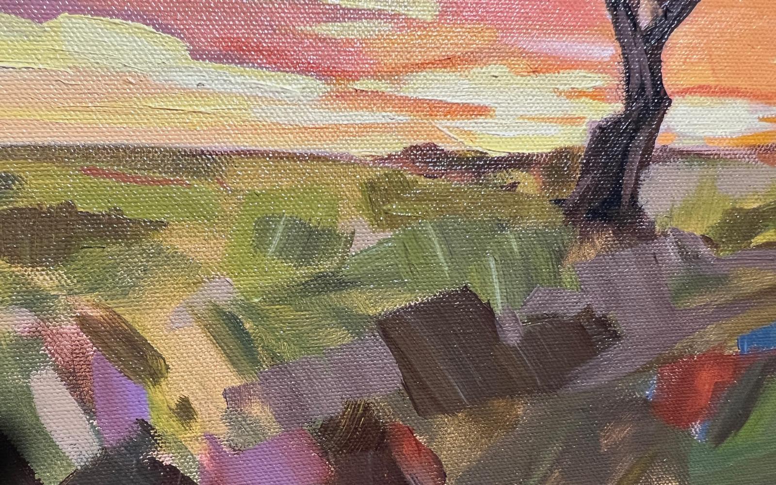 A closeup of Carla Bosch's "Rattlesnake Mountain" painting during the 2022 En Plein Air Texas competition in San Angelo, Texas