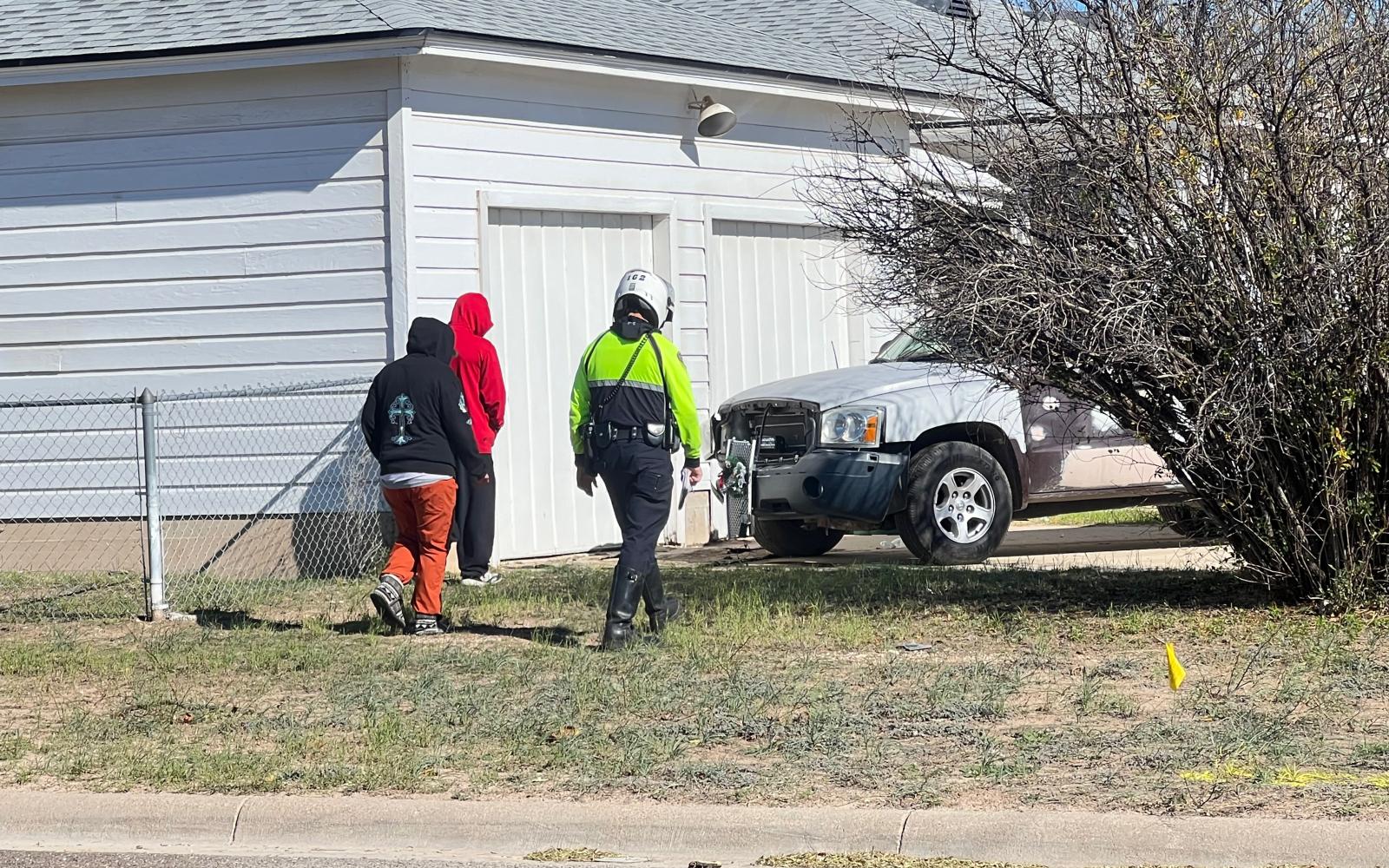 Two people arrive at crashed pickup and drive it away after it mowed down two telephone poles. 