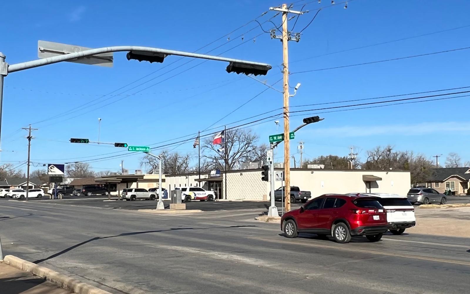 Traffic sensors on the traffic lights at the intersection of W. Avenue N and S. Jackson St. far out wide view.