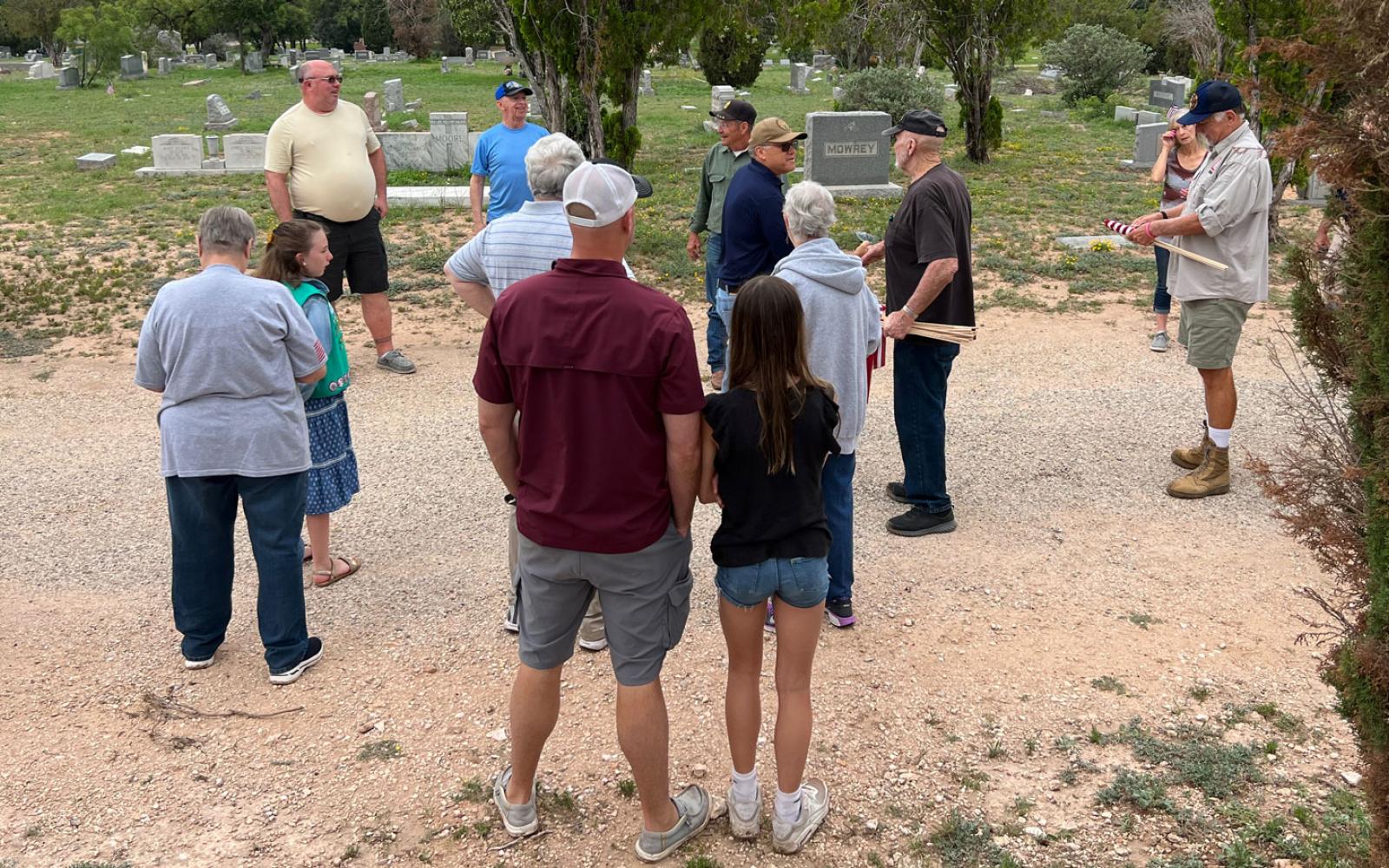 American Legion members organize the placement of flags at Belvedere cemetery on May 27, 2023.
