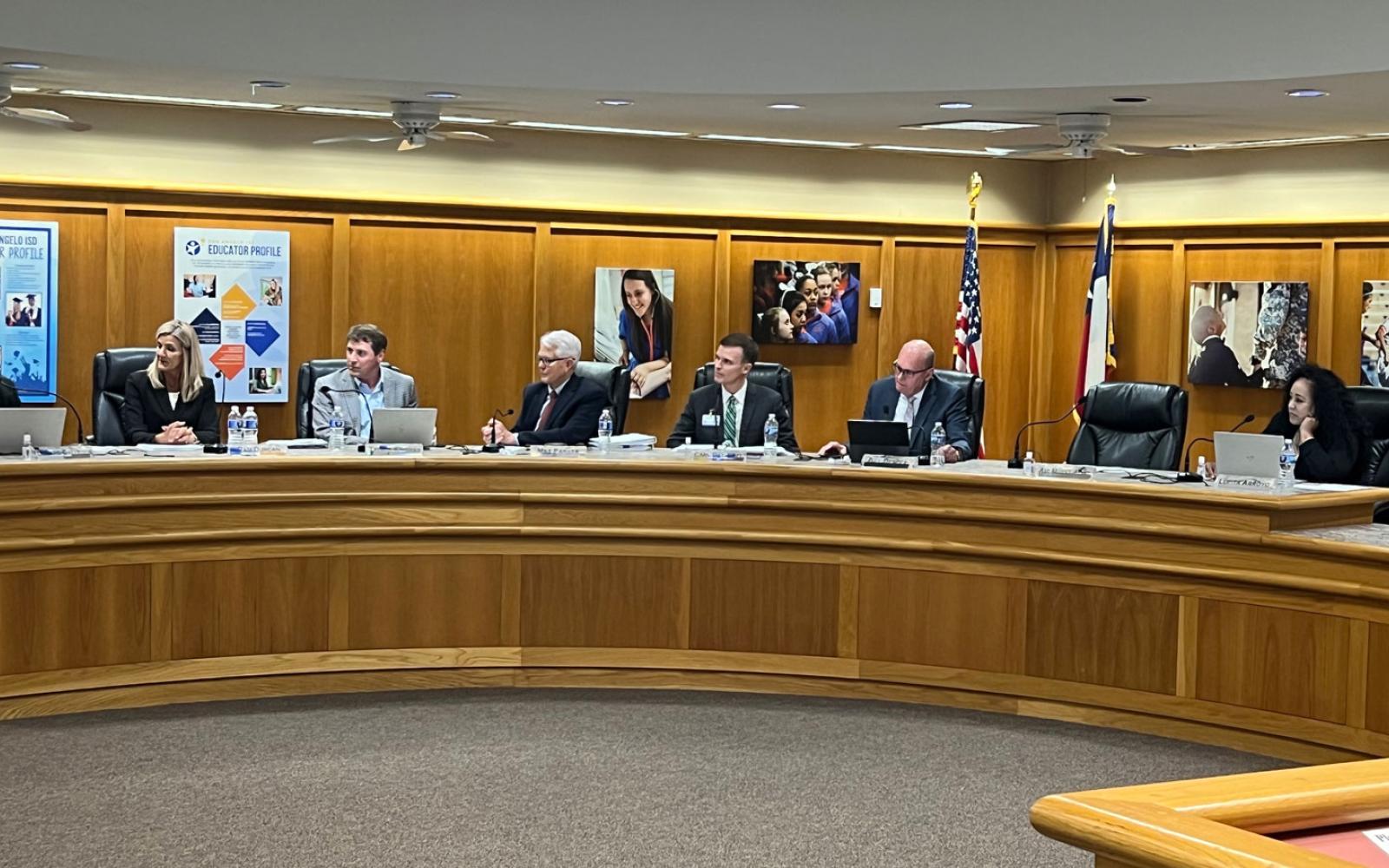 San Angelo ISD Board Trustee Gerard Gallegos pays tribute to outgoing Trustee Max Parker as other board members look on. Parker ended his 18-year service to the San Angelo ISD Board of Trustees on May 15, 2023.