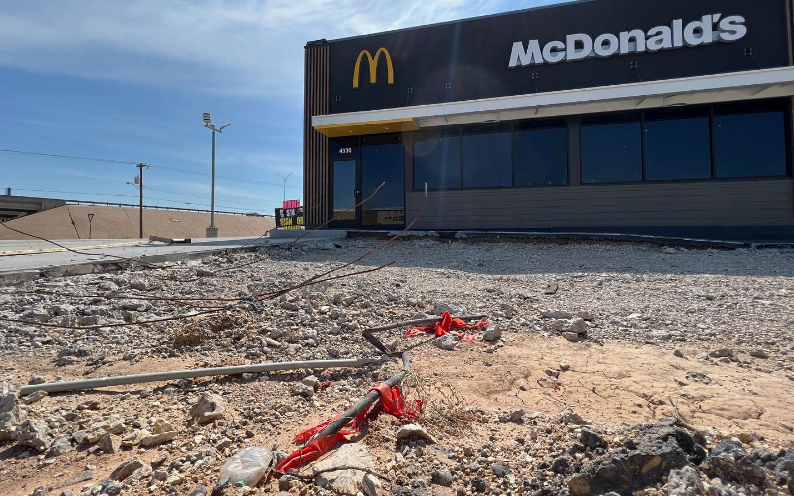 The new parking lot was poured and shortly thereafter demolished over quality concerns. 