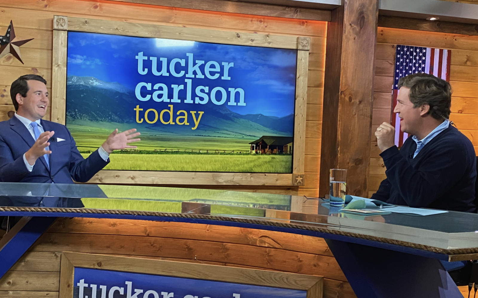 Alex Stein (left) with Tucker Carlson (right)