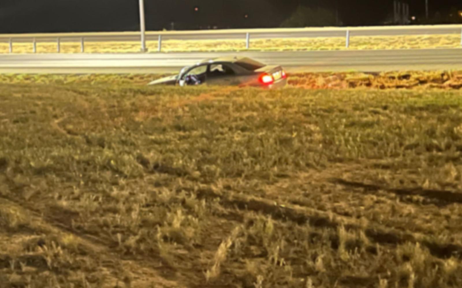 The car was abandoned running with the lights on.