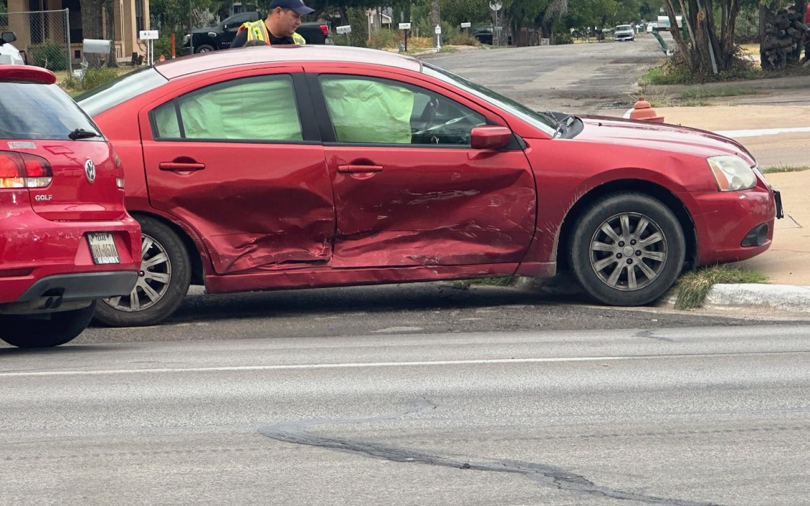A red Mitsubishi sedan was T-boned by the red Volkswagen hatchback on Sept 12, 2023.