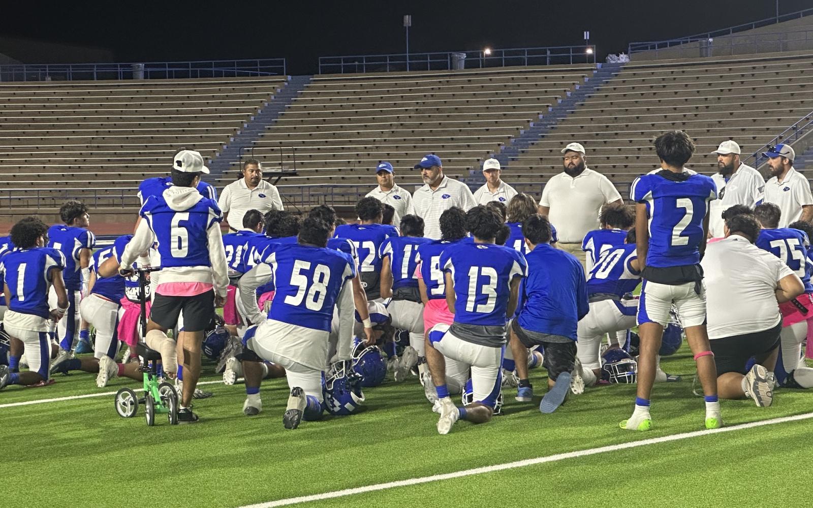 Coach Guevara talks to his team after loss to Andrews