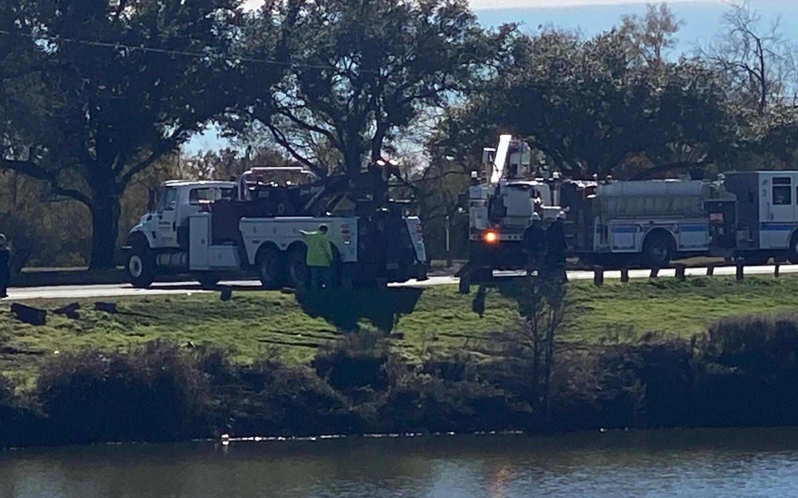 Police fish a car out of the Concho River
