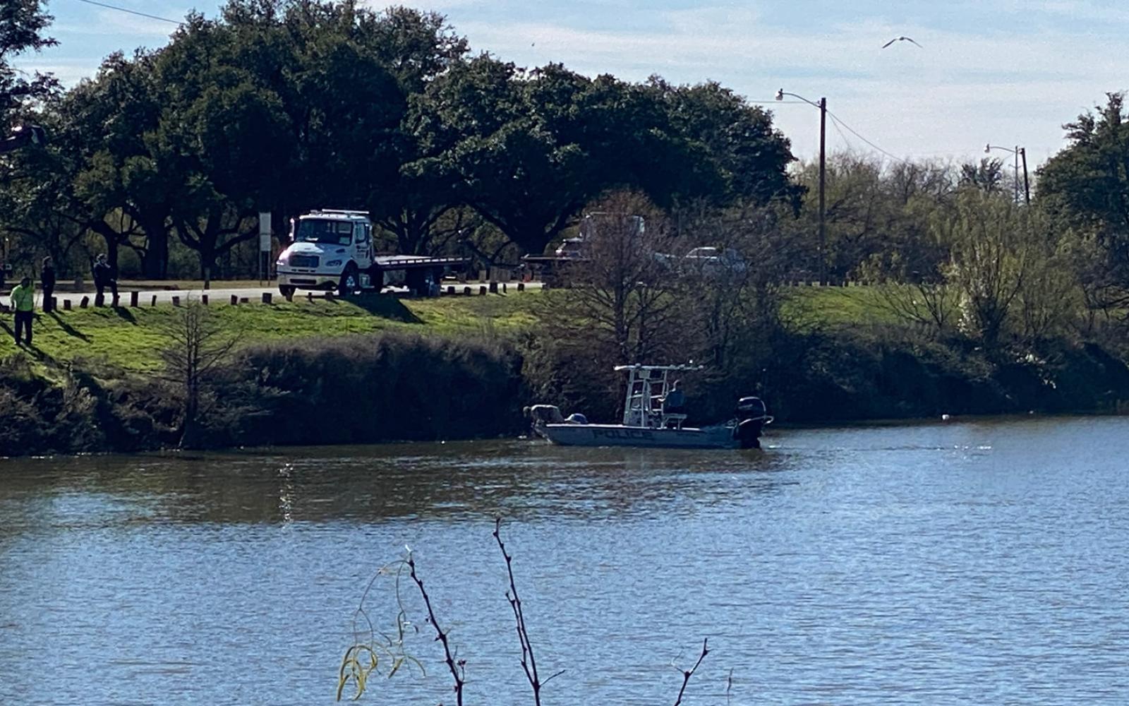 Police fish a car out of the Concho River