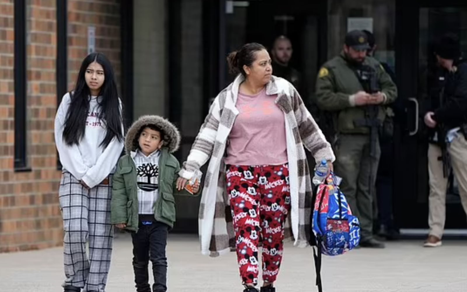 mother and her children leaving safely