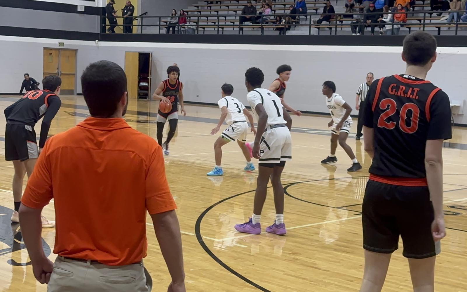 Bobcats Head Coach Rocky Feliciano looks on at his team against Permian