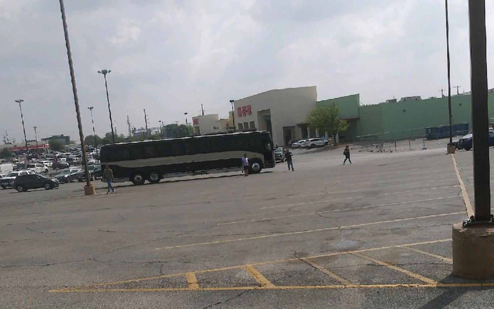 A mysterious bus full of males was unloaded at the old H-E-B parking lot on Wednesday at around 11:30 a.m.