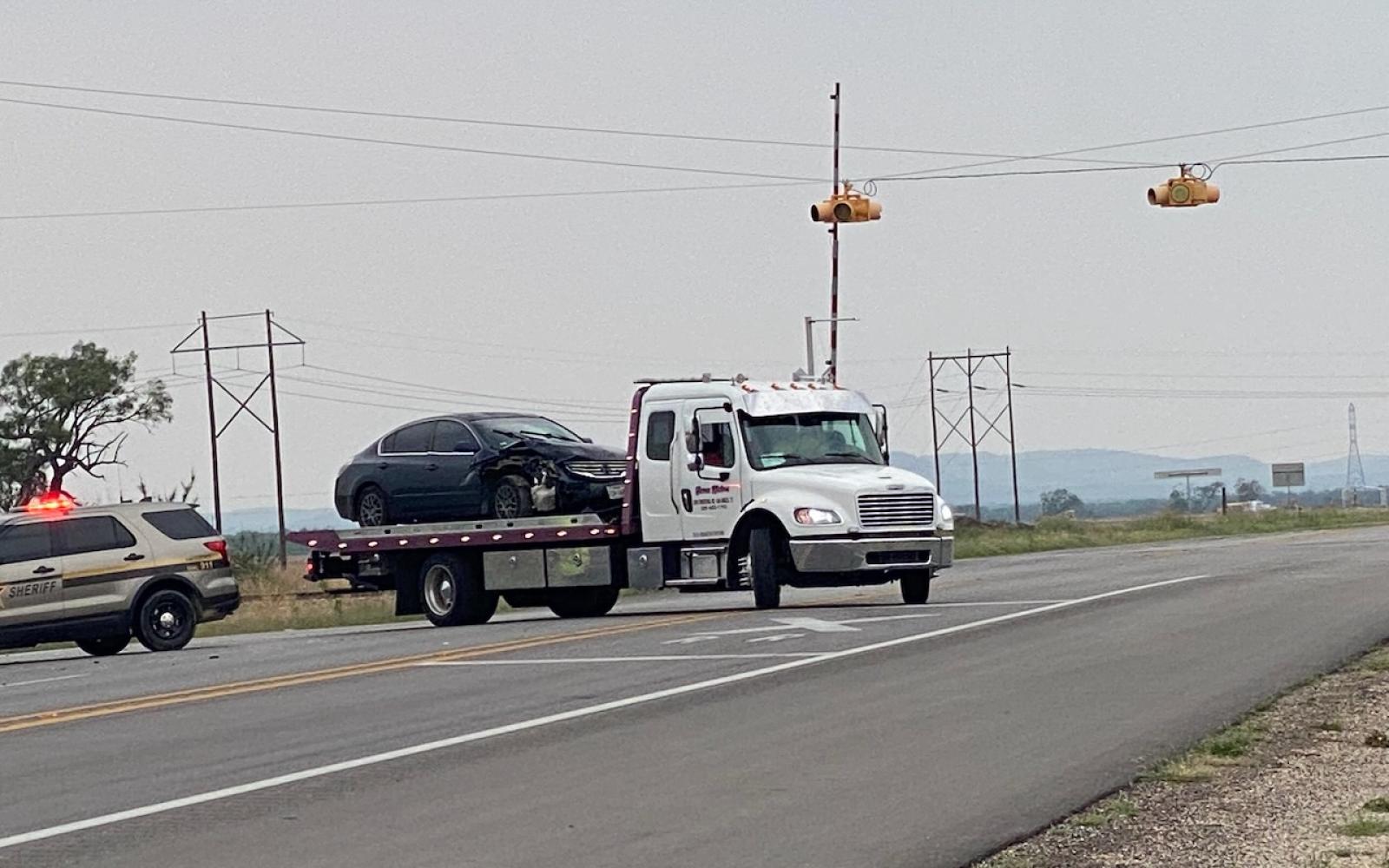 Altima Clips an Infiniti and Winds Up in a Ditch