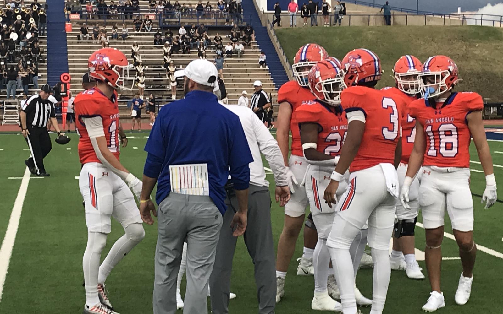 The Central Bobcats offense talks before heading onto the field Friday against Abilene High at San Angelo Stadium.