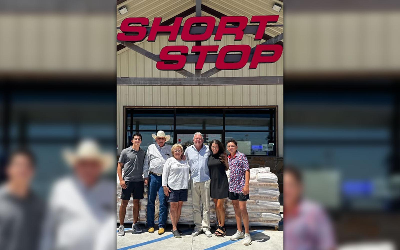 Pictured with Short Stop's Charlie Reichenau, Linda, and Clint are Clint's wife Brittany and their two sons Gage and Ian. 