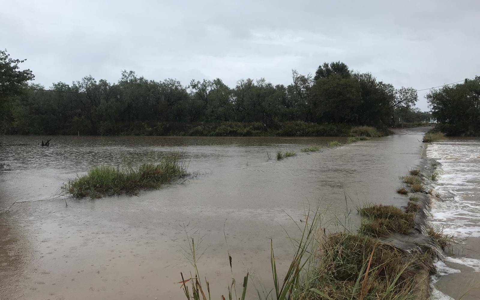 Water covers the road over a low-water crossing in Ballinger on Tuesday, Sept. 3, 2024.
