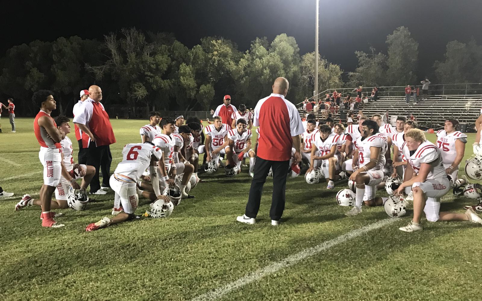 Miles head coach Jayson Wilhelm talks to his team after their loss to Albany on Friday, Oct. 11, 2024.