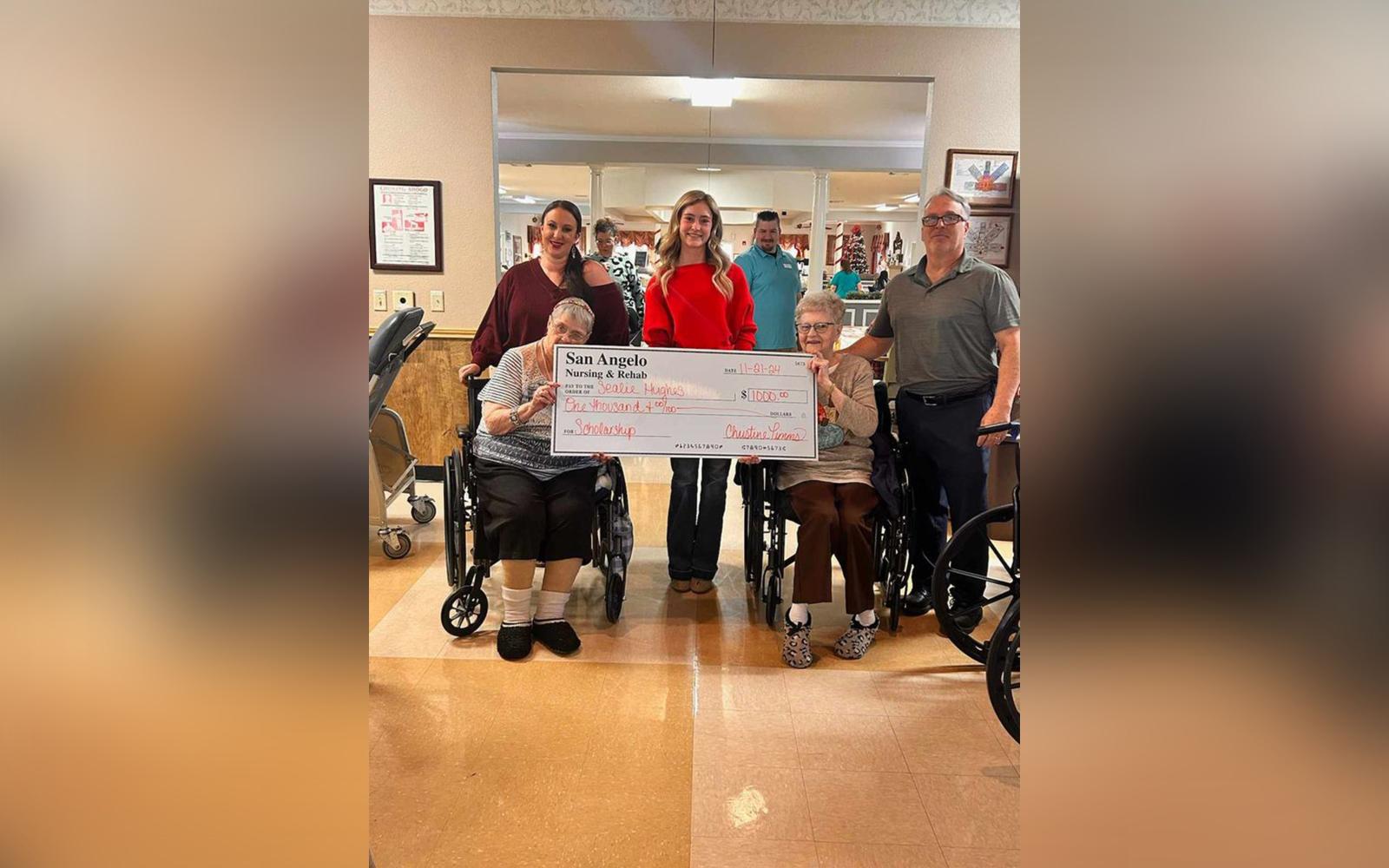 From left to right, back row: Christine Timms, Sealie Hughes, Ray Watt. Front row: Sondra and Beverly, residents of San Angelo Nursing and Rehab, hold the $1,000 scholarship check presented to Hughes.