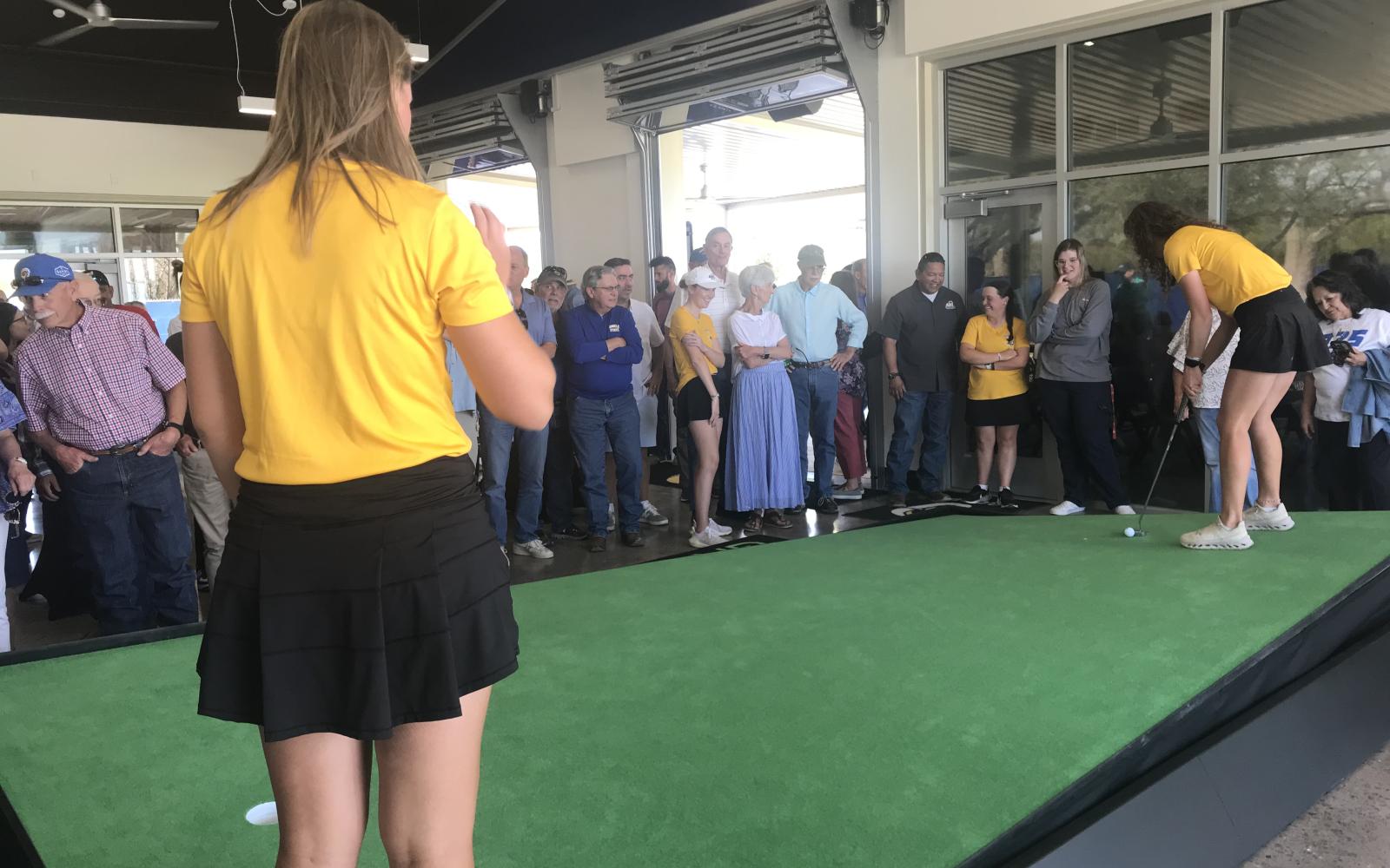 Angelo State women's golfers practice putting at their new on-campus complex Friday, March 28.