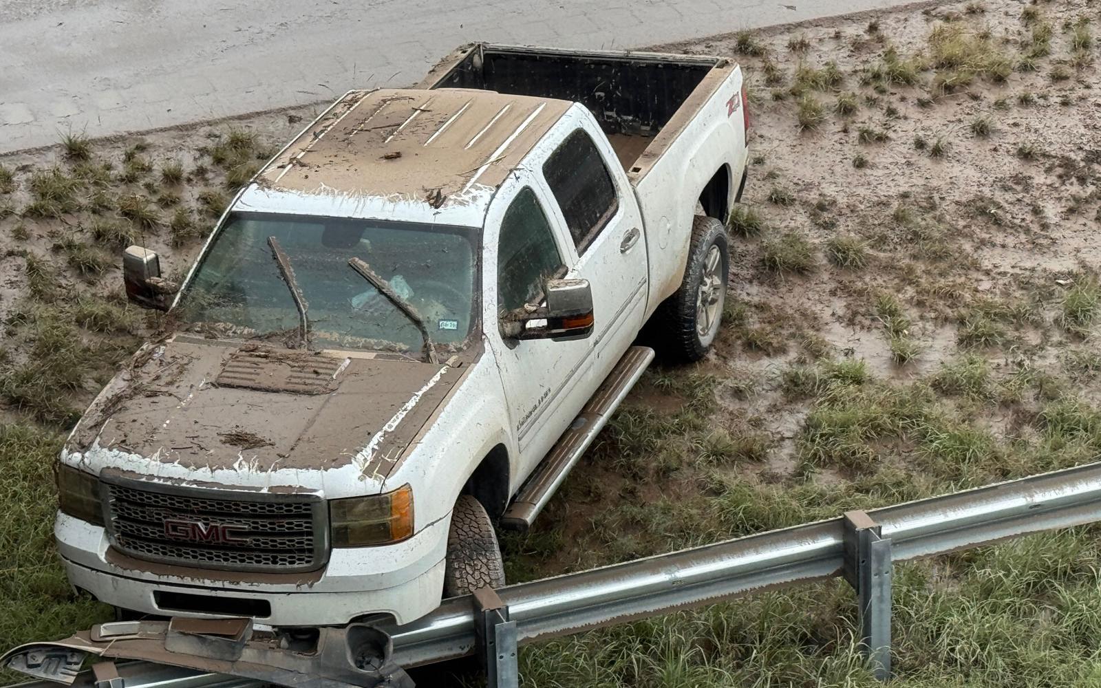 On the east side of the Bell Street overpass were more flooded cars revealed after the flood waters receded. 