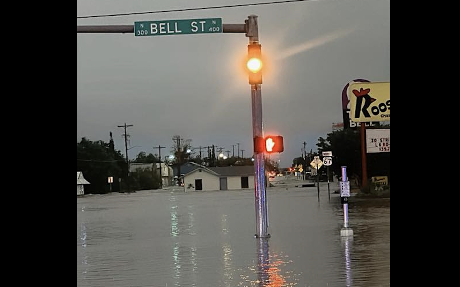 A structure is shown floating down Pulliam Street after heavy flooding in San Angelo on Friday, July 4, 2025.