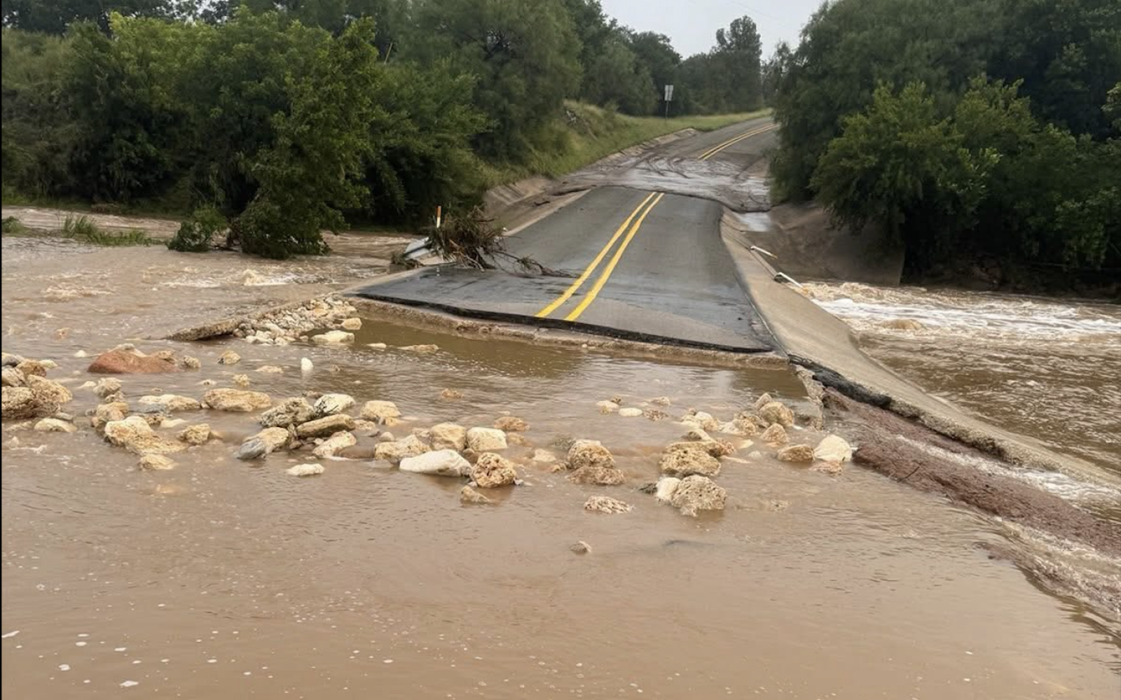 A road is washed away during the Texas Hill Country flooding.