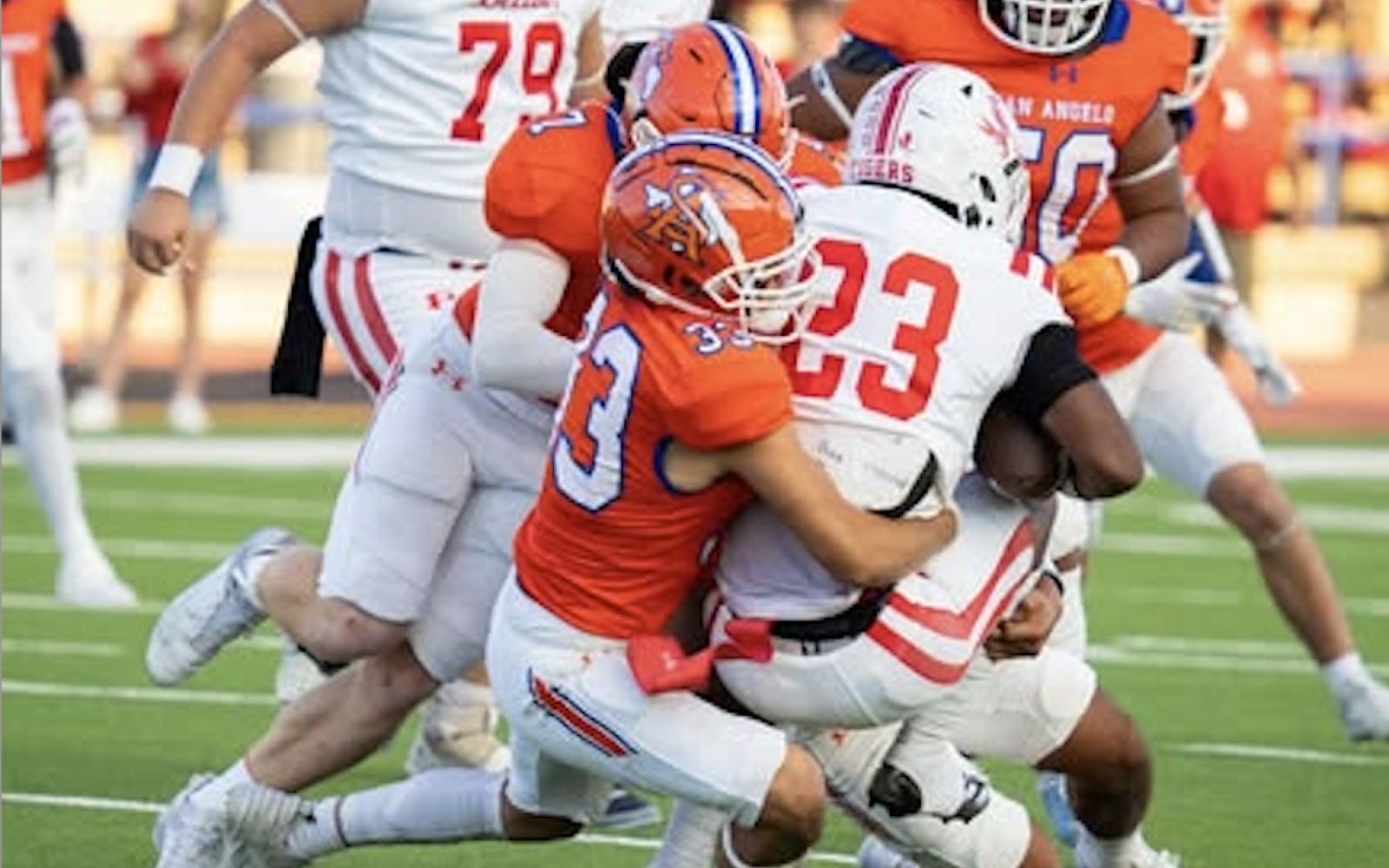 Mason Van Sickle (7) and Luisangel Garcia (33) combine for a tackle against Odessa High in their 2024 game at San Angelo Stadium.