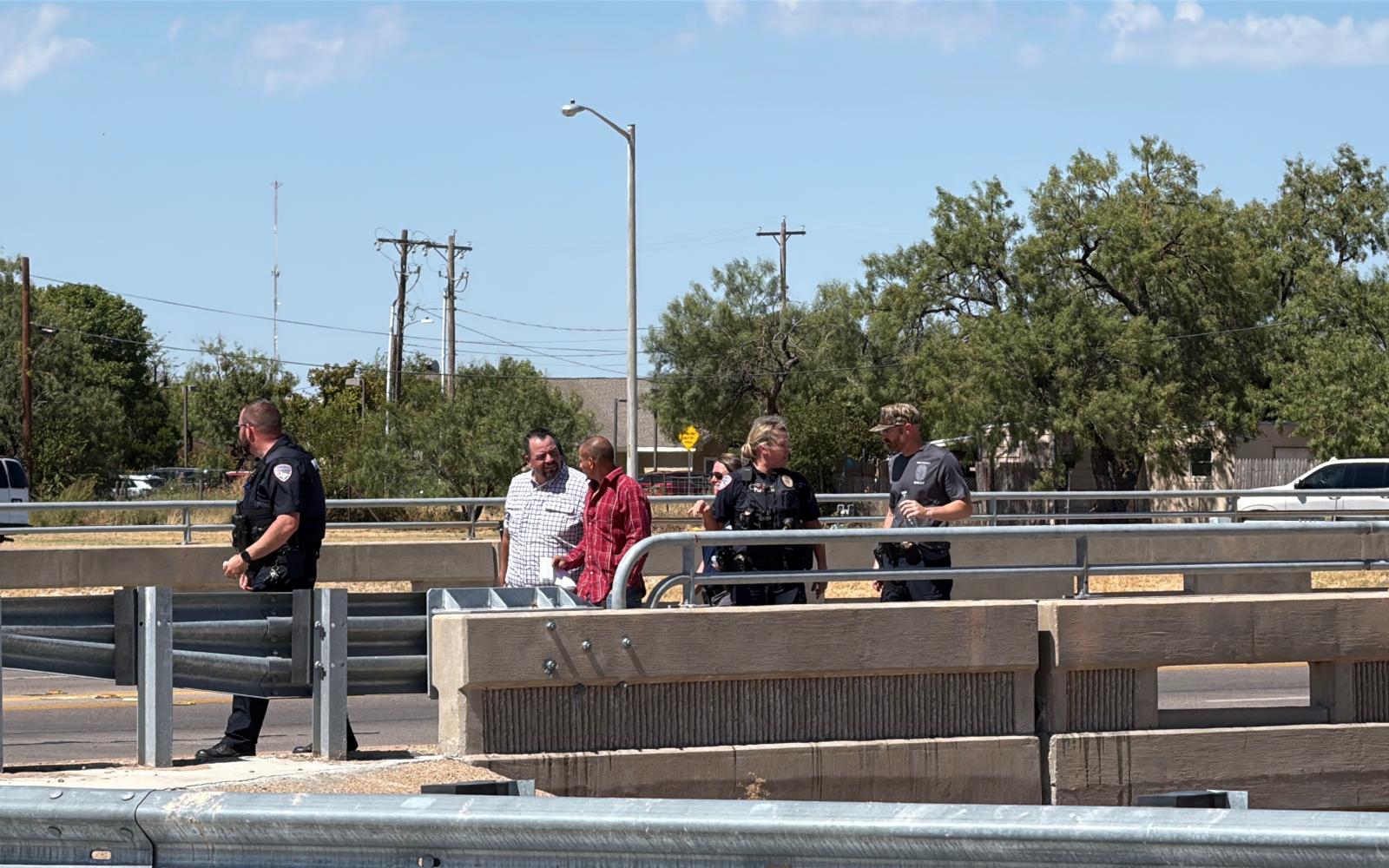A man threatening to jump from the Main Street overpass onto the Houston Harte Expressway has been talked out of the suicide attempt by police officers.