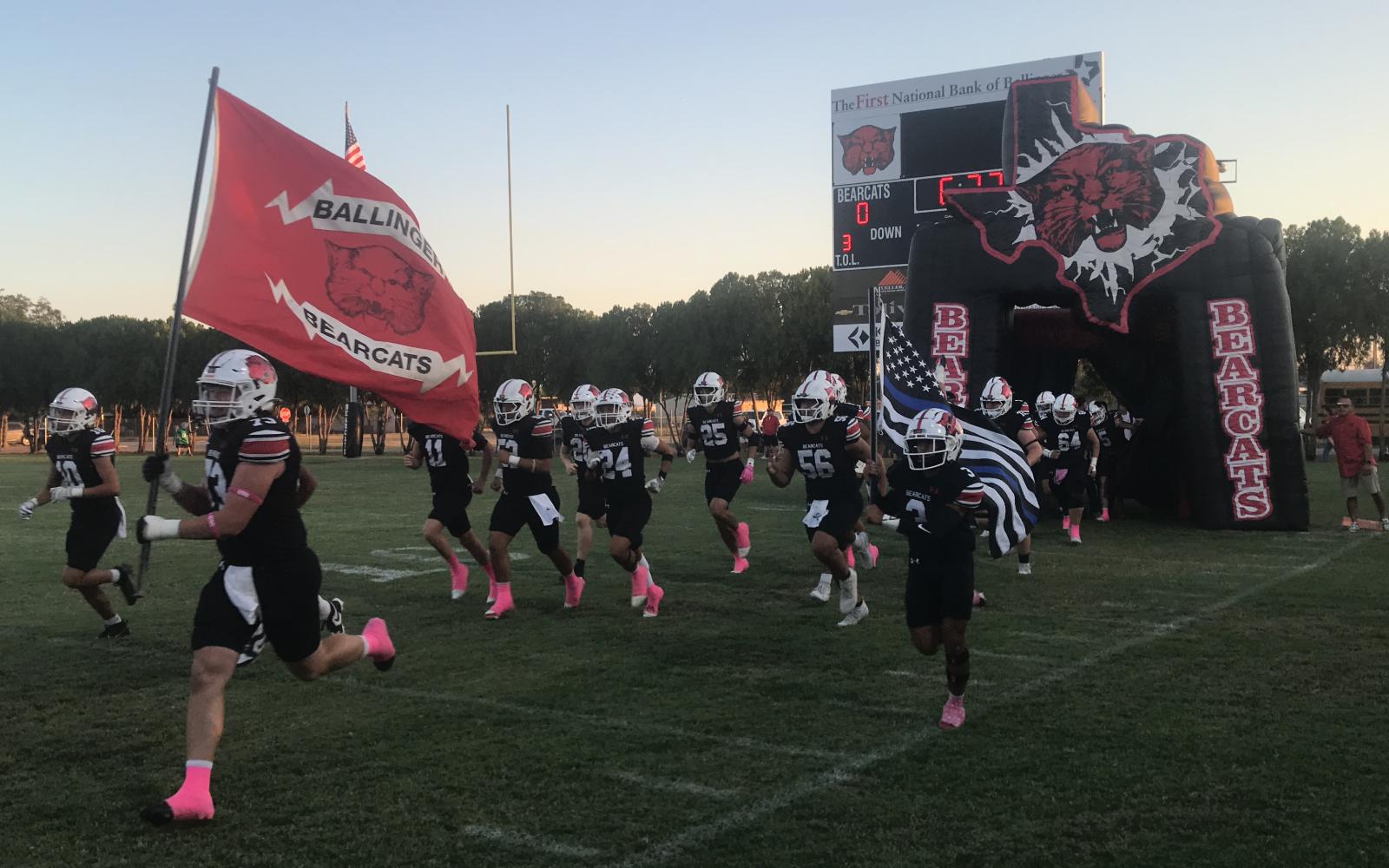 The Ballinger Bearcats run onto the field before their game against Bangs on Friday, Oct. 10, 2025, at Bearcat Stadium.