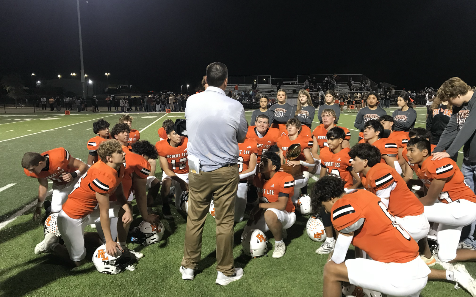 Robert Lee head coach Lee McCown talks to his team following their 60-14 win over Ira in the opening round of the playoffs Friday, Nov. 14, 2025.
