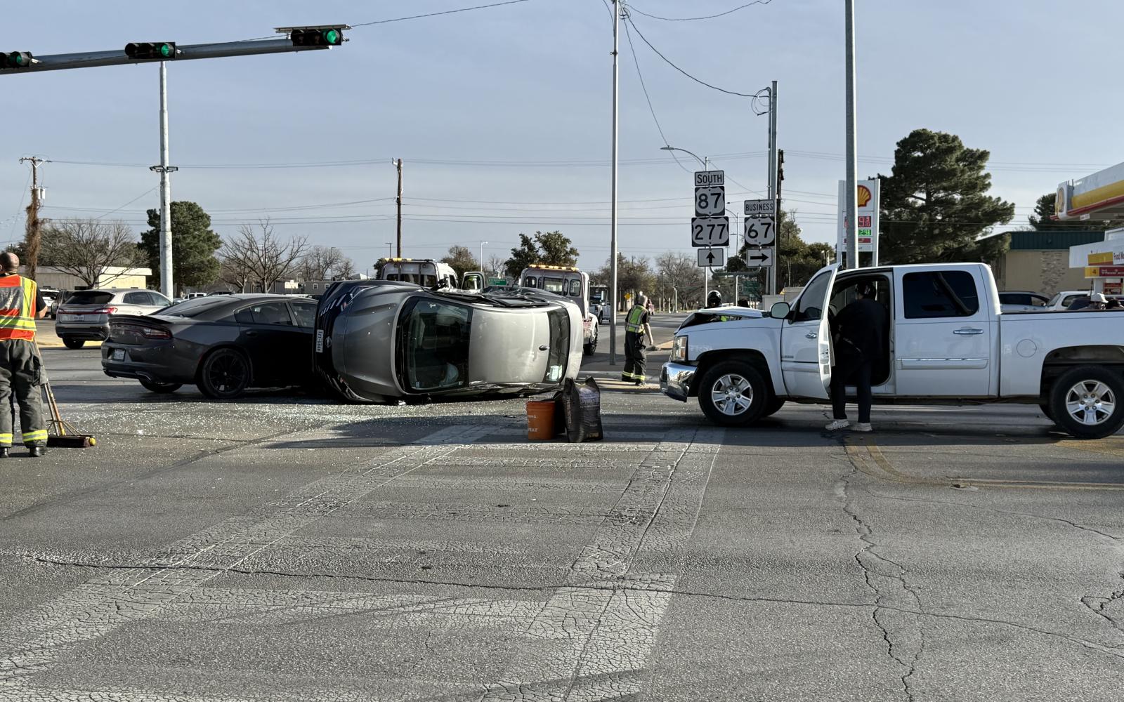 A three-vehicle collision Thursday afternoon in San Angelo resulted in a car rolling over on its side, completely shutting down Beauregard Avenue between Abe and David streets.