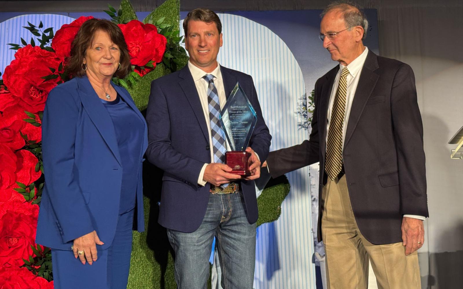 Justin Jonas (center) flanked by Jean Ann LeGrand and Bob LeGrand