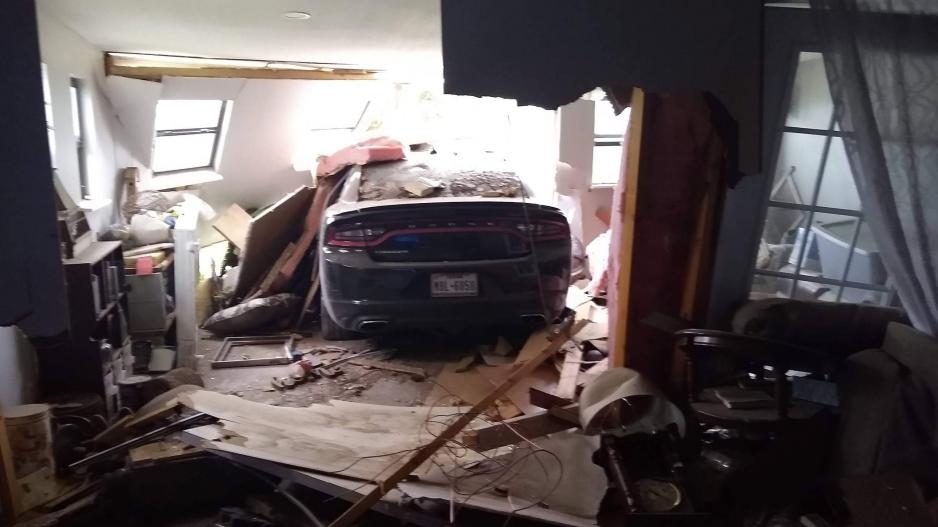 A black 2016 Dodge Charger crashed through a San Angelo home on July 11, 2021. A black 2016 Dodge Charger crashed through a San Angelo home on July 11, 2021.