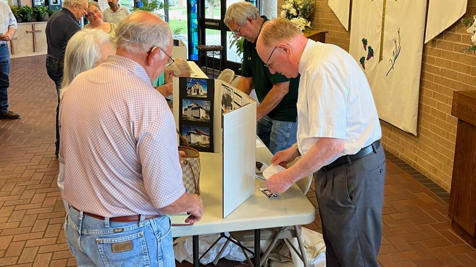 Father Mark Woodruff, pastor of the Sacred Heart Church in Menard, sells raffle tickets and collects donations for the restoration of the 1899 church at Holy Angels Catholic Church in San Angelo on May 20, 2023. Father Mark Woodruff (right), pastor of the Sacred Heart Church in Menard, sells raffle tickets and collects donations for the restoration of the 1899 church at Holy Angels Catholic Church in San Angelo on May 20, 2023.