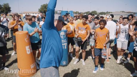 Former San Angelo Central head football coach Brent Davis talks to players during a workout.