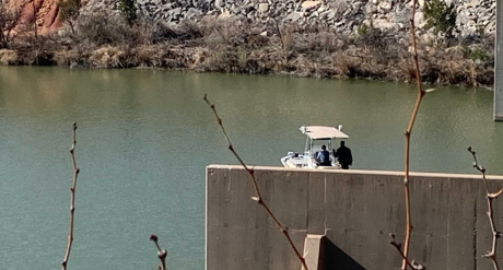 Law Enforcement Searching Spillway