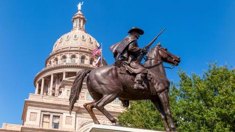 The Texas Capitol behind the Terry's Texas Rangers Monument