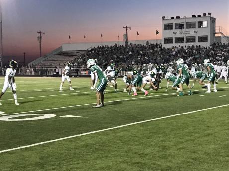 The Wall Hawks' defense prepares for the snap against Idalou on Friday, Oct. 4, 2024.