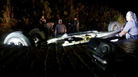 The overturned pickup in the South Llano River with 5 illegal migrants and the human trafficker as first responders attempted to rescue them in Oct. 2022.