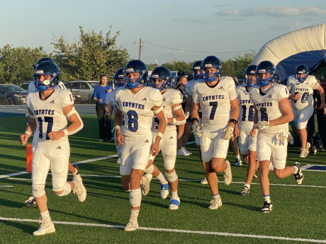 The Richland Springs Coyotes run onto the field before their football game against the Gordon Longhorns on Thursday, Aug. 28, 2025, in Priddy.