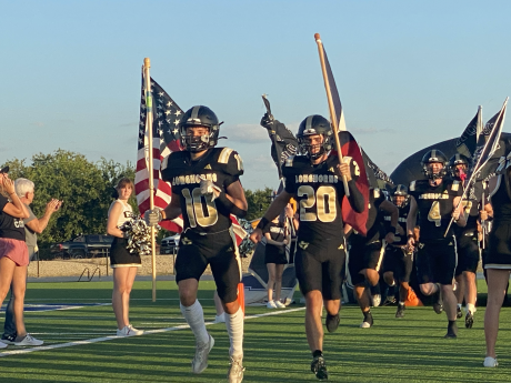 The Gordon Longhorns run onto the field before their football game against the Richland Springs Coyotes on Thursday, Aug. 28, 2025, in Priddy.