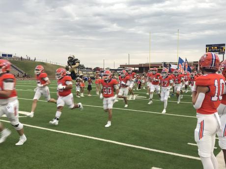 The Central Bobcats run onto the football field before their game against Amarillo High on Friday, Sept. 5, 2025, at San Angelo Stadium.