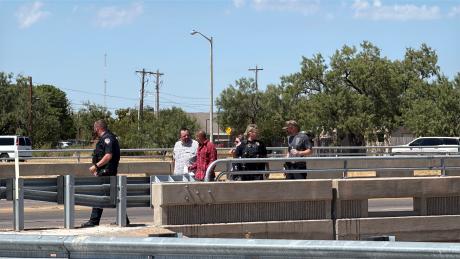 A man threatening to jump from the Main Street overpass onto the Houston Harte Expressway has been talked out of the suicide attempt by police officers.