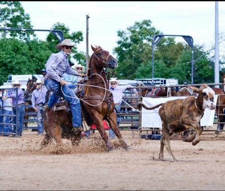 Caleb Smidt is showing roping a calf at an event in Bellville in 2014.