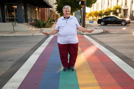 James Poindexter, Pride San Antonio Board Member, at the rainbow crosswalk in the city’s Pride Cultural Heritage District on Thursday. Poindexter helped organize the event where several community members, city officials, and leaders of LGBTQ+ and ally organizations rallied and signed a resolution urging the city to challenge Gov. Greg Abbott’s order to remove rainbow crosswalks throughout Texas.